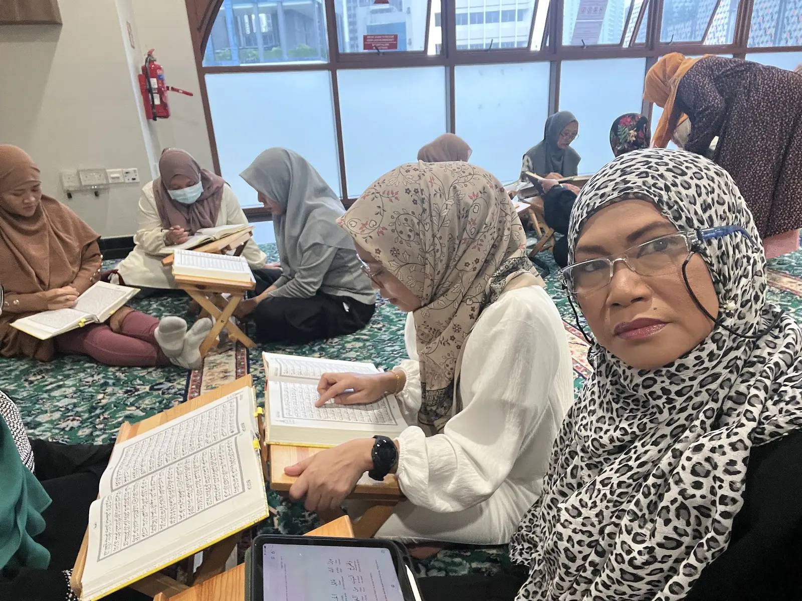 Raudhatul Jannah members reading the Qur’an together in small circles