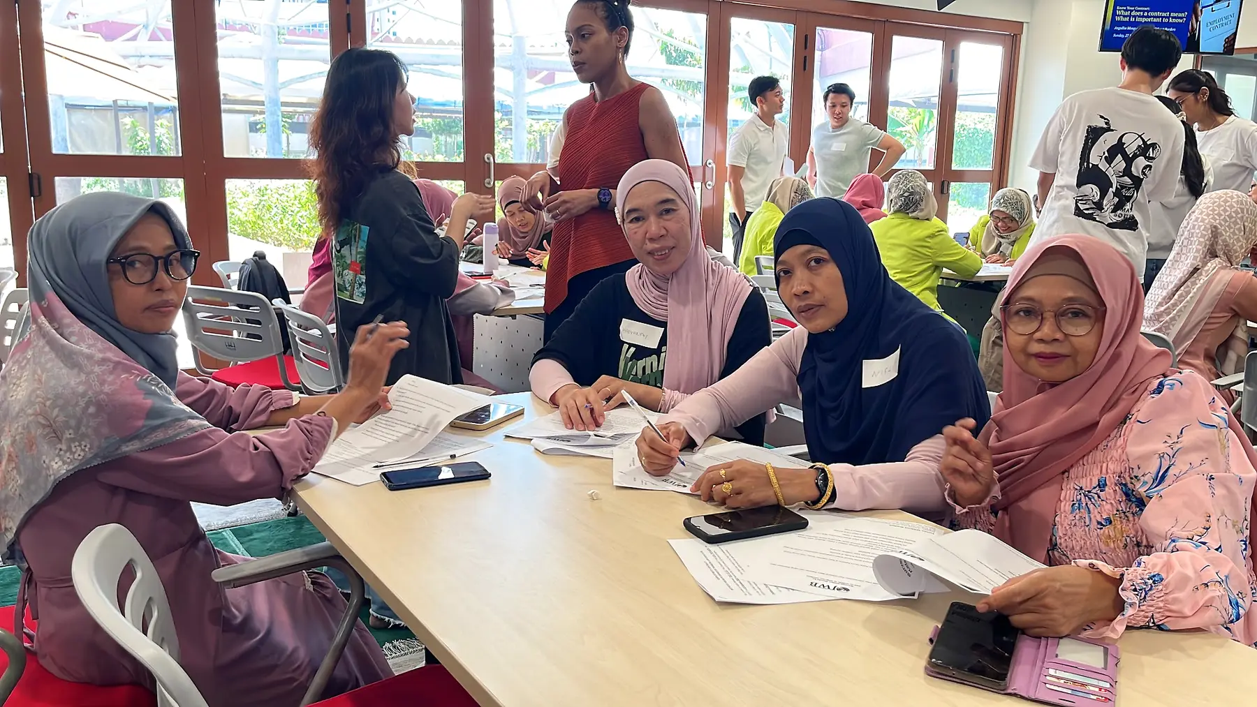 Raudhatul Jannah members taking part in a practical table-based learning activity